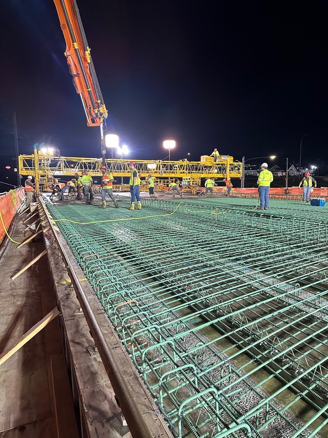 Crews pour concrete overnight for the bridge deck over Century Avenue/Highway 120