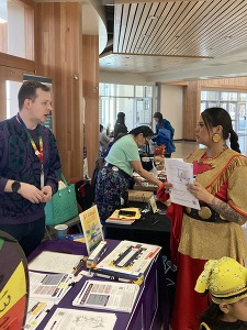 Woman and Outreach Specialist Discussing the Purple Line