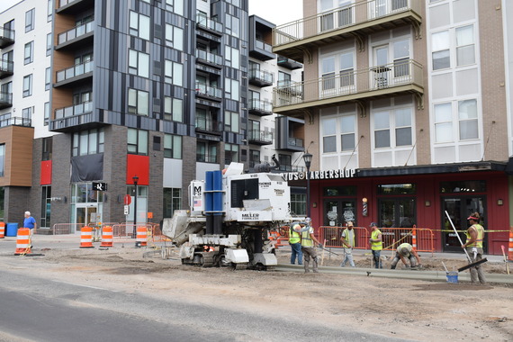 Crews installing curb and gutter at Lake & Fremont Avenue