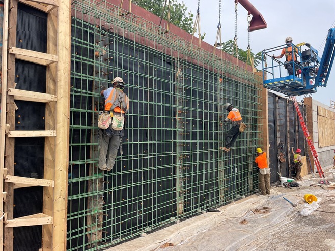 Crews install rebar for walls at White Bear Avenue