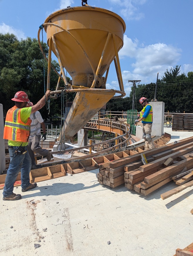 Crews pour concrete for Maple Pedestrian Bridge helix ramp