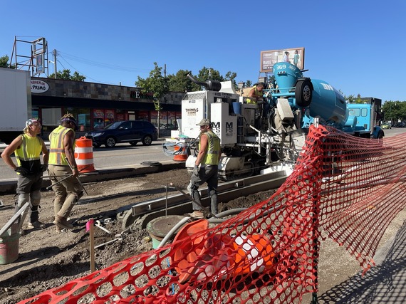 Crews working on curb and gutter