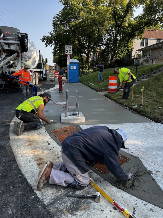 construction workers laying concrete 