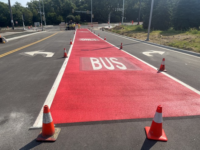 Crews install pavement markings along Guider Drive in Woodbury