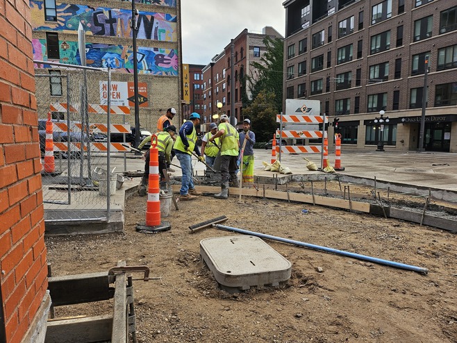 Crews reconstruct sidewalk and roadway at the Union Depot and Sibley Street station