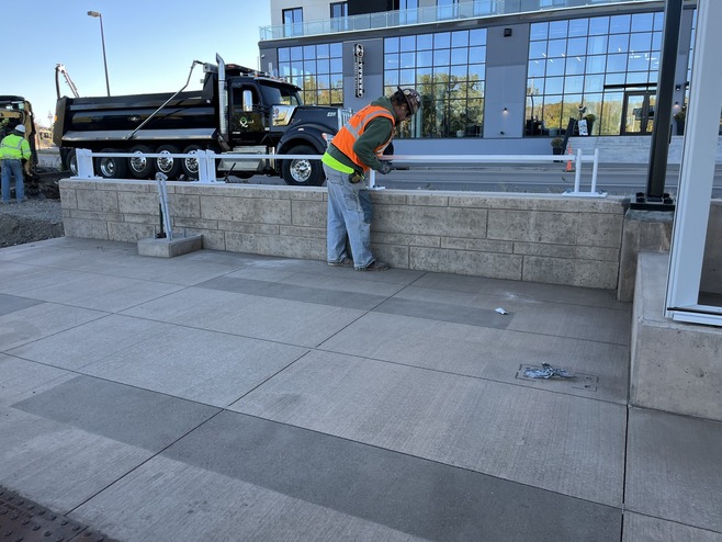 Crews install railings at the Helmo Station platform