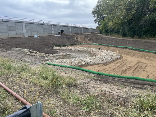 Crews construct a stormwater pond near Century Avenue/Highway 120