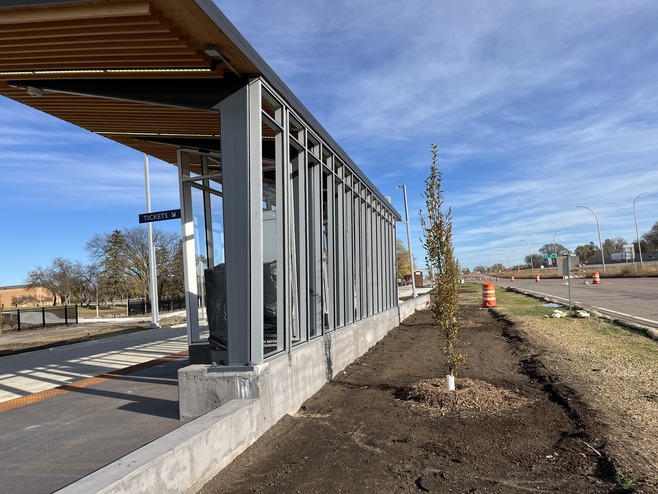 Crews plant trees at the Maplewood Station