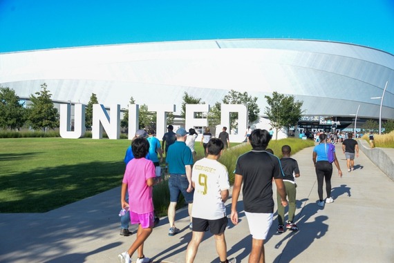 Crowds and commuters near Allianz Field during Major League Soccer (MLS) All-Stars Week 2022