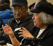 Person talking while another one listens.