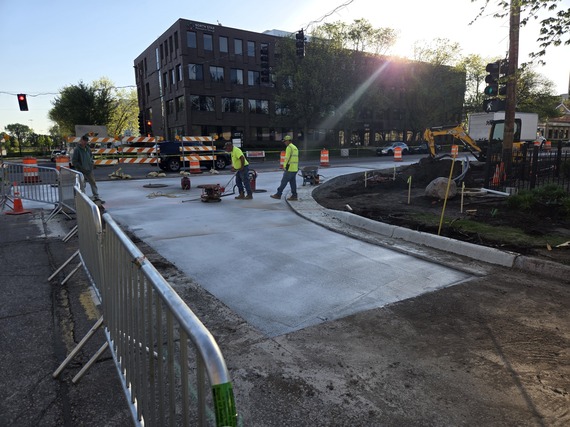 Construction workers tamping concrete