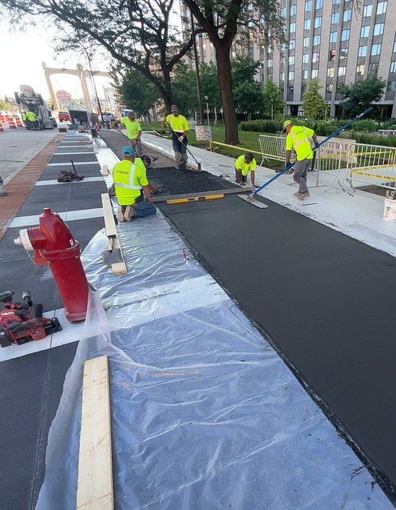 Workers constructing roadways