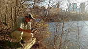 An ecologist taking measurements on Nicollet Island.