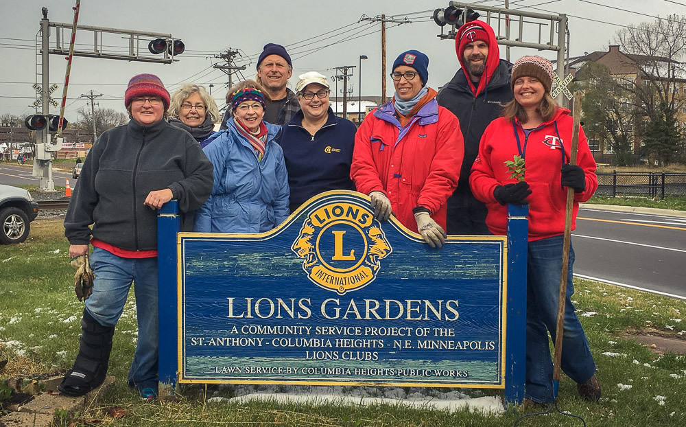 Volunteers posing at the Lions Gardens in Columbia Heights.