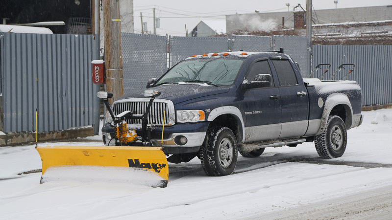 A snow plow truck in winter.