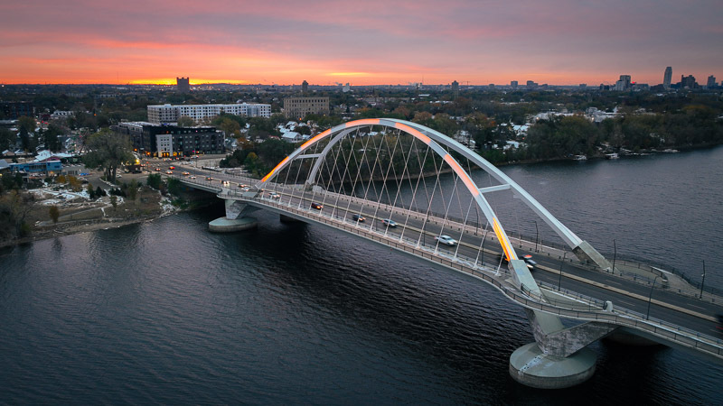 Aerial view of the Lowry Avenue Bridge at sunrise.