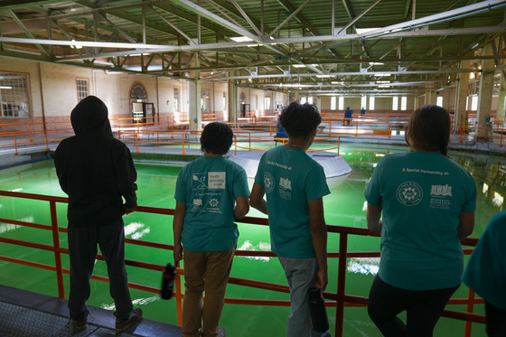 Members of the Mississippi River Green Team viewing the softening pools during a tour of the drinking water treatment facility in Fridley