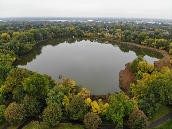 An aerial image of Sullivan lake with green trees