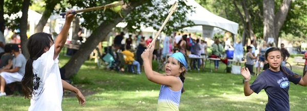 Photo of kids playing a game at Owamni Falling Waters Fetsival