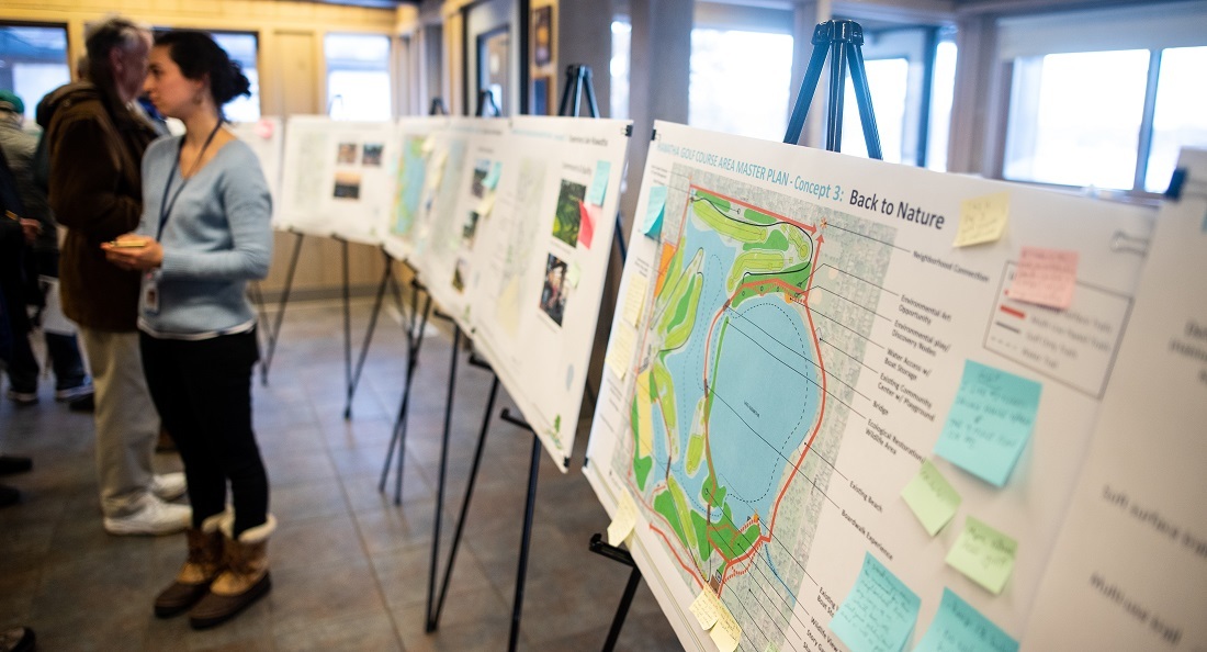 Informational displays with sticky notes attached to them in the clubhouse at Hiawatha Golf Course during an open house event in March 2019