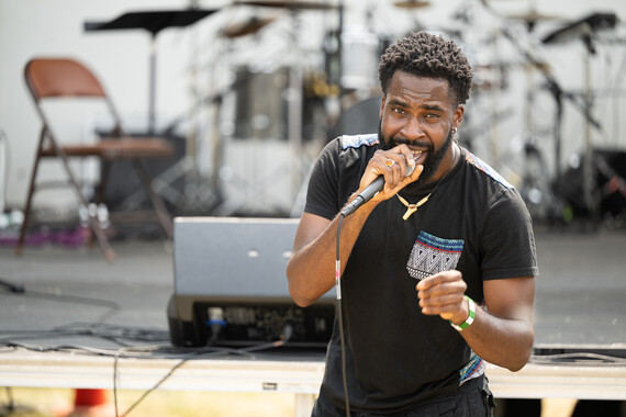 A man with a microphone performs during Juneteenth at Bethune Park