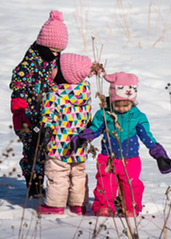 Young kids playing outside in winter