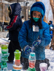Child building colorful ice castles