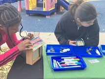 Youth at a nature exploration table