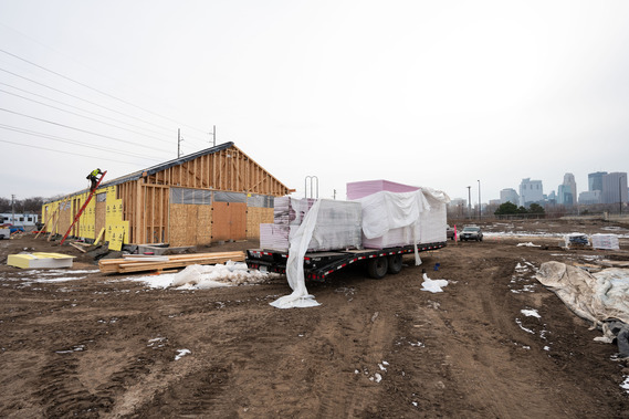 Graco Park under construction in the winter. The construction site shows dirt, snow and new concrete steps.