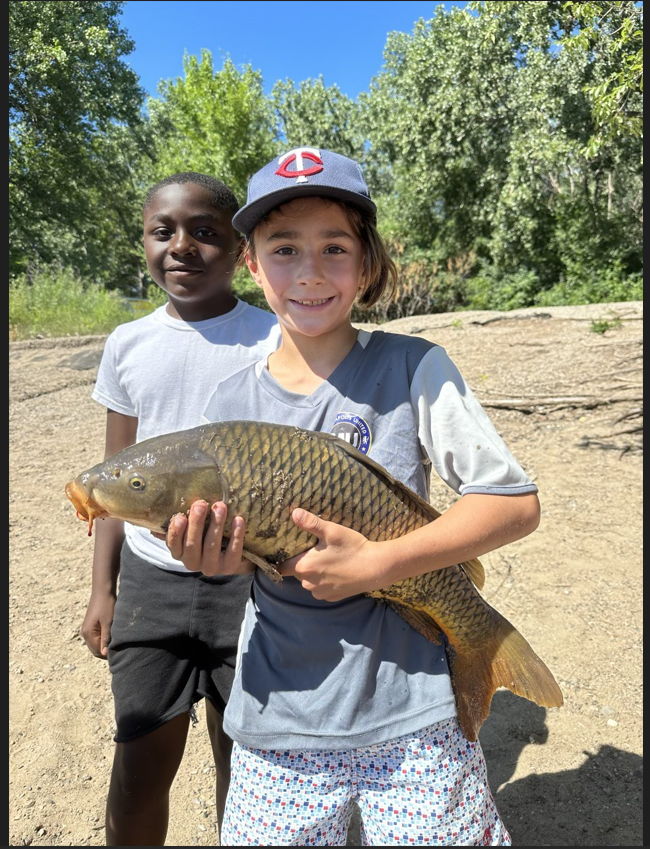 kids with a fish