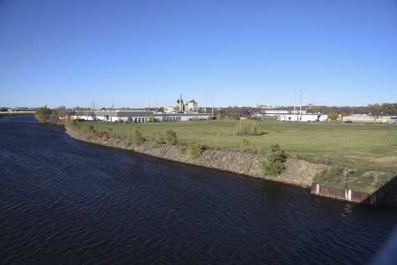 The future site of Graco Park, an open field on the Mississippi River, in 2017