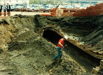 MPCA personnel look over separating combined sewers in the agency's back parking lot in St. Paul in 1993