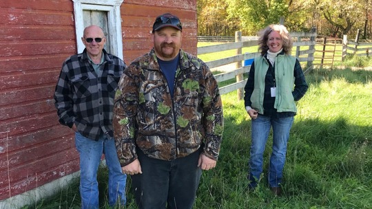 Bob Helle, his son Mike, and Todd SWCD Manager Deja Anton