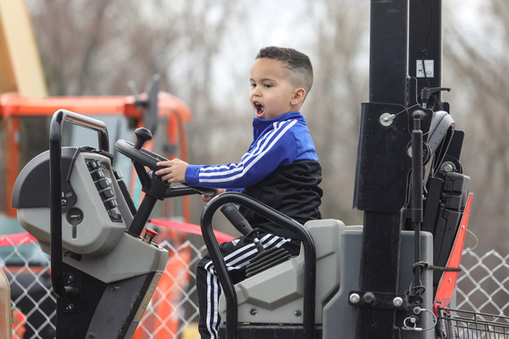 photo of young boy exploring city equipment at Discover Plymouth 