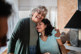 Happy grandmother and granddaughter smiling