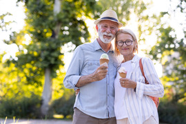 Man and woman eating ice cream contes
