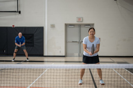 Pickleball players in gym