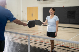 Dementia friendly gym, smiling pickleball players