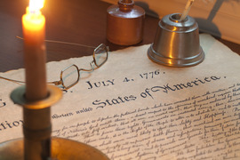 Photo of declaration of independence with candle