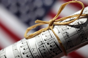 American flag with scroll of music