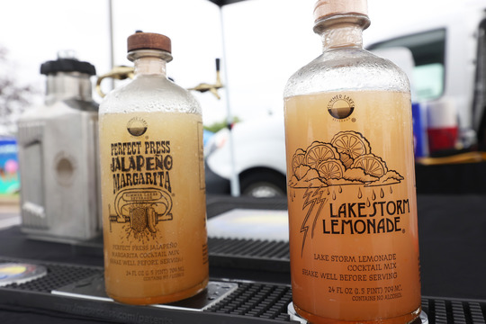 Photo of two beverage bottles filled with liquid