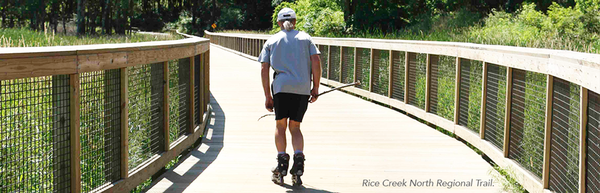 Resident rollerblading on Rice Creek North Regional Trail. 
