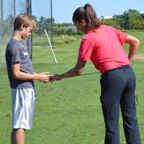 Youth attending golf lesson