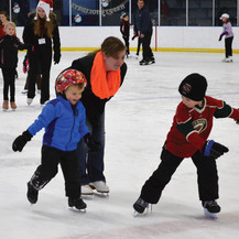 Mom and kids skating at Aldrich Arena
