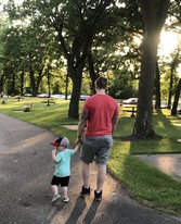 Dad and child walking on path