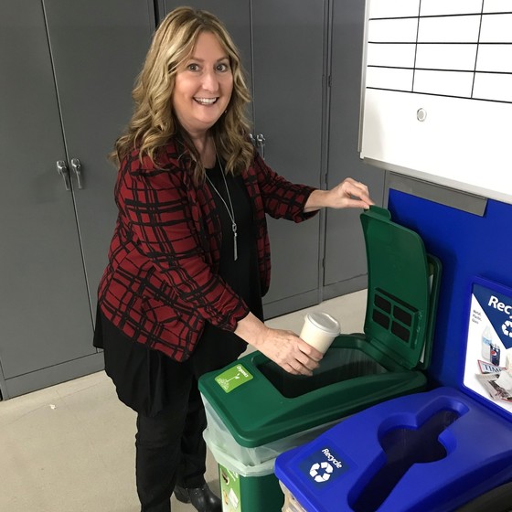 Photo of a woman recycling