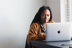 Woman sitting at computer