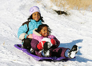 Girls sledding