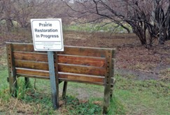 Prairie restoration sign and bench