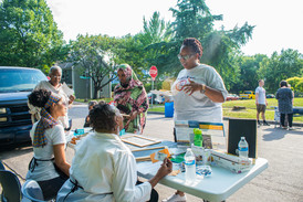 Community Artists engaging with community members about the Dale Street Bridge project